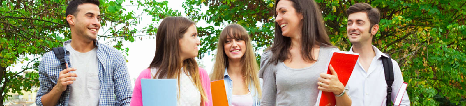Students with binders walking